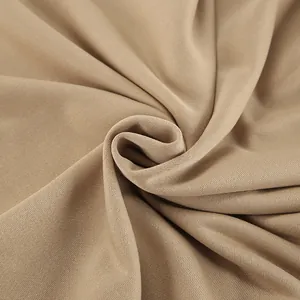 Close-up detail of the soft khaki knitted fabric texture for women's autumn sweatshirt set