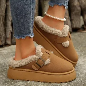 Side view of warm tan fur-lined platform clogs with buckle detail for winter