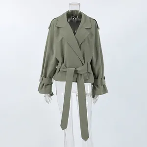 Close-up detail of olive green French style belted trench coat featuring a large lapel design