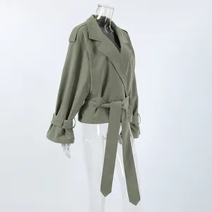 Side view of sage green trench jacket featuring a large lapel and adjustable waist belt.