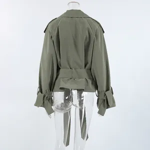 Detailed back view of a khaki green short trench coat featuring a waist tie on a mannequin