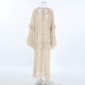 Detail view of khaki sheer chiffon dress with bell sleeves and ruffled hem design