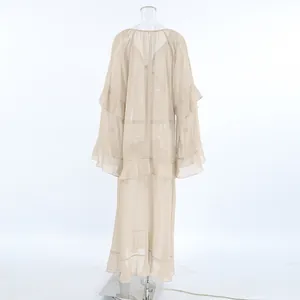 Back view of a sheer khaki chiffon maxi dress with tiered ruffles and bell sleeves