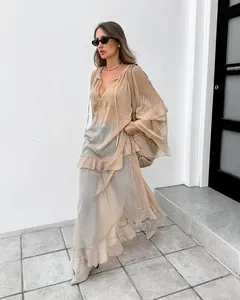 Close-up detail of khaki sheer chiffon maxi dress featuring loose batwing sleeves and ruffles