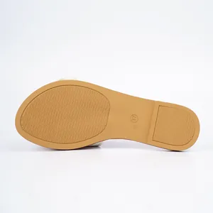 Macro view of the textured anti-slip rubber sole on flat sandals showing the size 37 detail