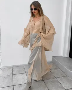 Elegant sheer khaki chiffon dress featuring loose batwing sleeves and flowy maxi fit.