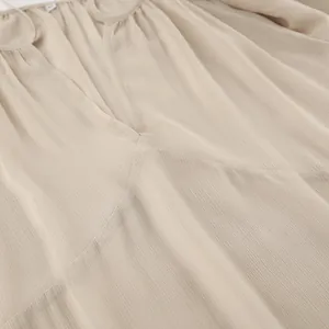Macro close-up of khaki chiffon dress fabric texture with elegant V-neckline detail