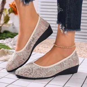 Detailed view of breathable apricot lace mesh pumps with comfortable wedge sole