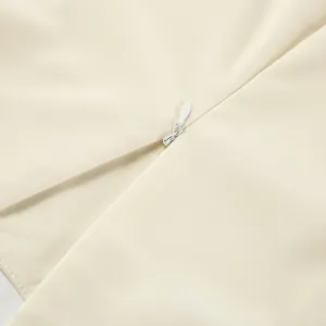 Close-up detail of the concealed zipper and chiffon fabric on the French style shirt
