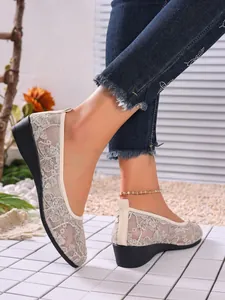 Close-up of breathable lace mesh flat shoes for women in summer