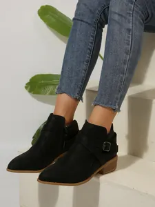 Elegant black pointed toe Chelsea boots with cross straps and side zipper for women