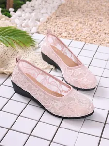 Detailed view of breathable pink lace mesh flat shoes for women with a round toe design