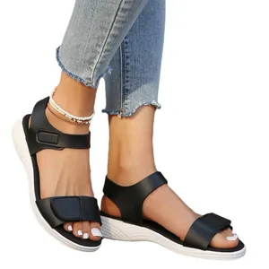 Comfortable women's black low wedge sandals with velcro straps for summer beach wear