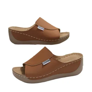 Brown platform wedge slides for women with fashion label and peep toe design, brown