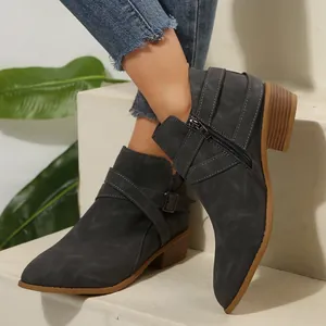 Stylish grey pointed-toe Chelsea ankle boots featuring cross straps and side zipper
