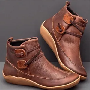 Vintage brown leather flat ankle boots with decorative buttons and wrap-around straps