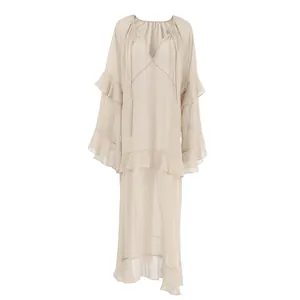 Detailed view of khaki ruffled maxi dress featuring sheer fabric and elegant flare sleeves