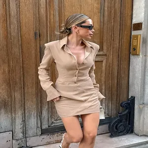 Elegant khaki textured long sleeve dress with cinched waist and asymmetrical wrap skirt