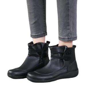 Stylish black leather ankle boots for women, features side strap details for casual winter wear