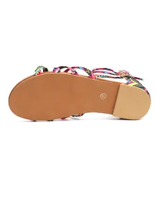 Bottom view of bohemian flat sandals with colorful patterned straps and size 37 mark