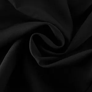 Macro view of high-quality black fabric texture for women's professional blazer
