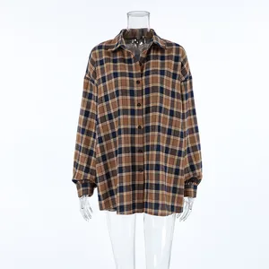 A detailed front view of this brown and blue plaid oversized shirt with a lapel collar