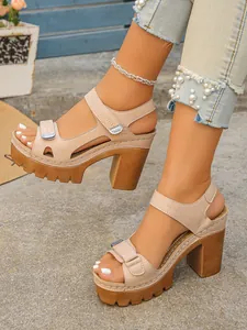 Stylish beige platform high heel sandals featuring lug soles and ankle straps on feet