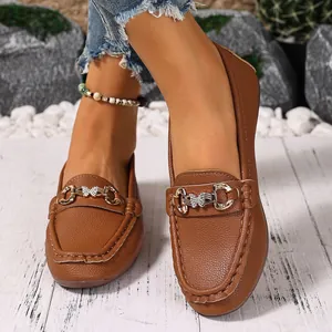 Classic brown women's loafers featuring an elegant butterfly metal buckle design