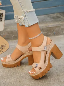Beige chunky platform high heel sandals with serrated sole and ankle strap for women.