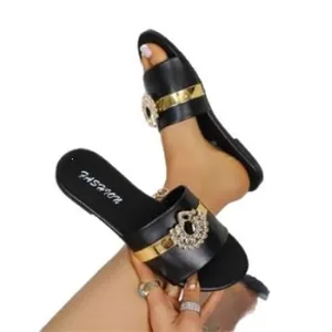 Elegant black flat slide sandals with gold band and rhinestone buckle for women