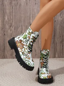 Detailed close-up view of women's floral print combat boots featuring black laces