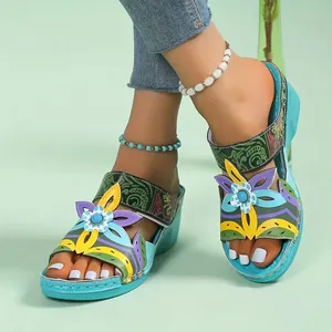 Stylish women's ethnic wedge sandals with colorful floral accents for summer comfort