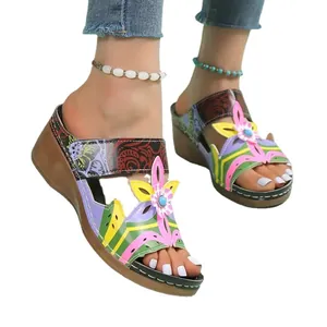Colorful bohemian wedge sandals with ethnic floral print and comfortable platform.