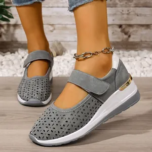 Stylish grey laser-cut wedge sneakers featuring breathable holes and velcro strap for summer