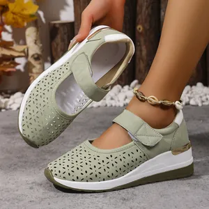 Lightweight sage green cutout wedge sneakers with breathable mesh and velcro straps