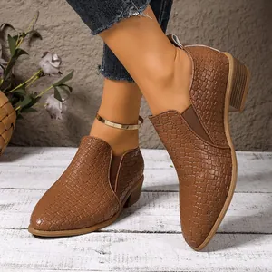 Brown pointed toe low heel shoes featuring a woven texture and elastic side panels