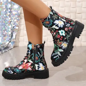 Vibrant floral embroidered black Martin boots with chunky lug soles for stylish women