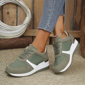 Detail view of sage green platform sneakers with thick white soles for stylish women