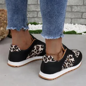 Detailed view of stylish women's leopard print casual sneakers with flat soles
