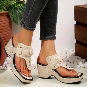 Elegant woven wedge flip-flop sandals with decorative metal buttons for summer beach