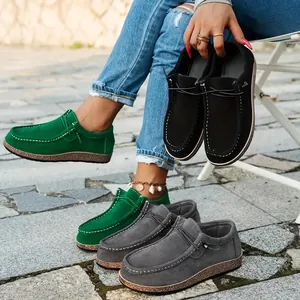 Detailed view of women's colorful casual loafers featuring thick wood grain soles.