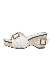 Side profile detail of women's wedge sandal featuring white leather and woven texture.
