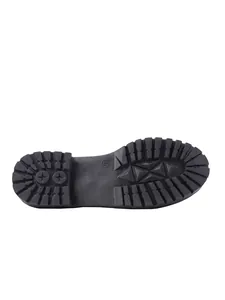 Close-up of the durable lug sole on women's French style flat loafers