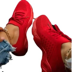 Breathable red fly-knit sneakers for women with lightweight and comfortable sole
