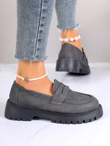 Grey suede loafers with chunky black platform soles for a British style look