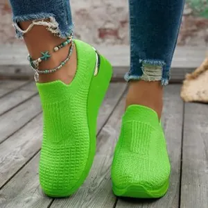 Women's neon green flying knit mesh sneakers with casual wedge platform sole and metallic detail