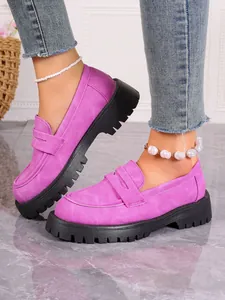 Stylish purple platform loafers with chunky soles and white pearl anklet details.