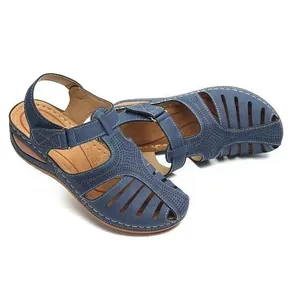 Navy blue women's wedge sandals with a closed-toe cutout design and hook-and-loop strap.