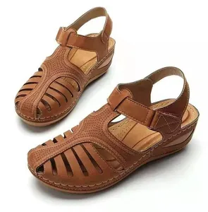 Elegant women's casual brown wedge sandals featuring hollow-out design and velcro strap