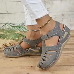 Stylish grey women's wedge sandals with breathable cut-out closed toe and Velcro strap